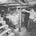 Allan shows us how he plumbed his heavily insulated hot water storage tank to the wood-burning furnace.